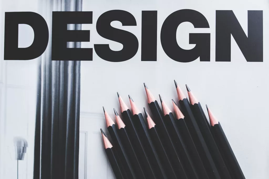 Black pencils and Design word branding