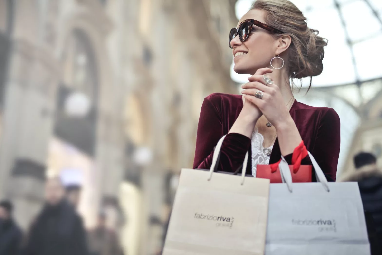 Photo of a Woman Holding Brand Shopping Bags